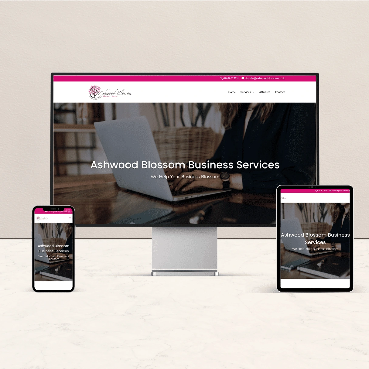 This shows an example of a website that advertises Business Service, as shown on a desktop, laptop and tablet.